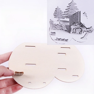 Detailed laser-cut wooden pieces for 3D Christmas puzzle with assembly guide