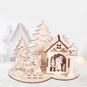 Detailed laser-cut wooden nativity scene stable with festive Christmas pine trees