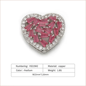 Macro shot of 15mm heart pendant connector with pink baguette stones and white zircons
