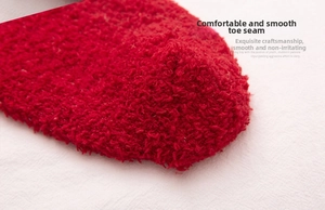 Detail of red coral fleece sock toe with seamless stitching for winter warmth