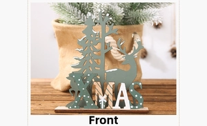 Detail of Nordic wooden Xmas decor featuring laser-cut reindeer and layered pine trees