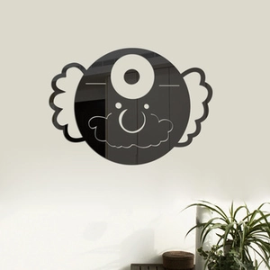 Detail of a 3D acrylic mirror wall sticker featuring a black cartoon monster face design