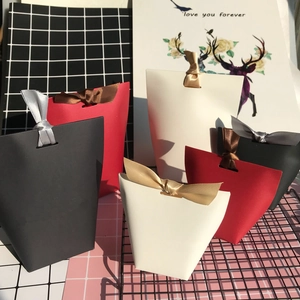 Minimalist trapezoid wedding favor gift boxes with elegant ribbon bows in various sizes