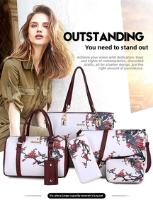 Detail shot of 6-piece cream handbag set with red floral prints and plum leather straps