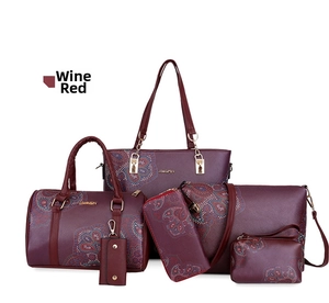 Detailed six-piece wine red handbag set with vintage prints and gold-tone zippers