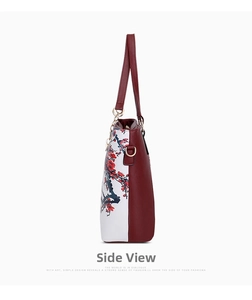 Side view of white and red leather tote bag featuring detailed red plum blossom prints