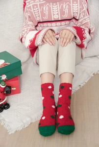 Thick warm coral fleece Christmas socks in red with green accents and polka dot patterns