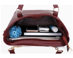 Interior view of red PU leather tote bag showing large capacity and internal pockets