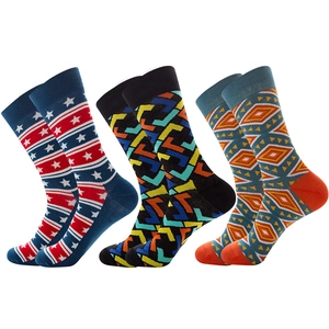 Three pairs of patterned mid-calf socks with geometric, stripe, and ethnic knit designs
