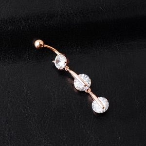 Elegant rose gold belly button ring with three clear round zircon stones on leather