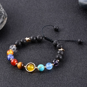 Detail of 8mm Solar System bracelet featuring lava stone beads and colorful planet stones