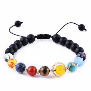Close-up of 8mm planetary beads bracelet featuring natural stones and lava rock detail