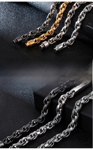 Detailed macro of brushed stainless steel double chain bracelet with screw clasp