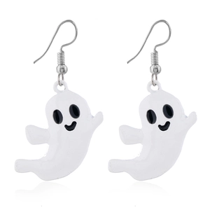 Close-up of white ghost halloween earrings with black eyes and a silver hook