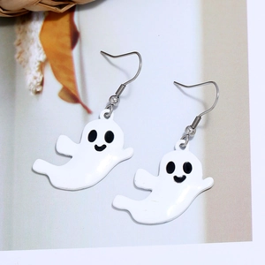 Close-up of white ghost earrings with black facial details and silver hooks