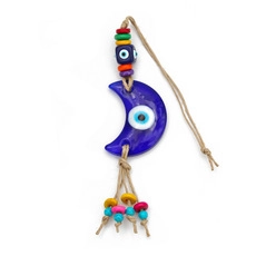 Detailed view of handmade owl evil eye wall hanging with ceramic crescent and colorful beads