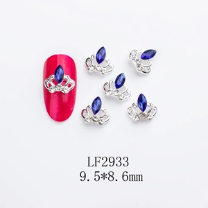 Macro view of crown-shaped nail charms with blue K9 rhinestones and 9.5x8.6mm dimensions