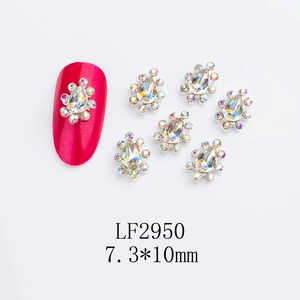 Detailed macro view of 7.3x10mm teardrop crown nail charms with AB crystals and silver base