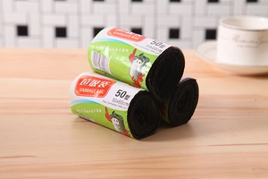 Detailed view of three rolls of thickened black 50x60cm PE plastic garbage bags