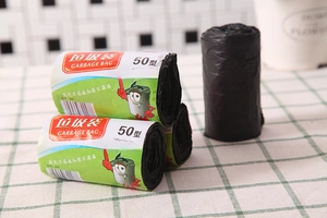 Detail showing high-density thickened black rolls of 50x60cm household garbage bags