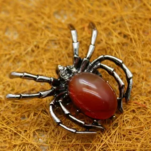 Gothic spider brooch pendant with vintage silver finish and oval carnelian gemstone