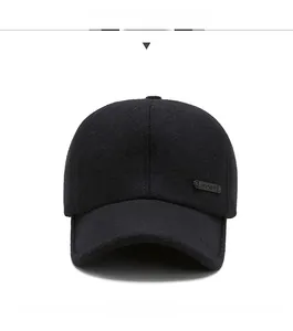 Front view of black winter baseball cap with thick wool fabric and side metal detail