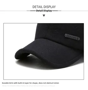 Detail of black winter baseball cap showing thick wool fabric and SPORT metal emblem