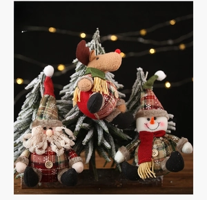 Three plush Christmas figurines featuring Santa, Reindeer and Snowman with plaid fabric