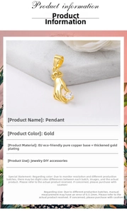 Detailed close-up of gold plated copper hand pendant with clear zircon for DIY jewelry