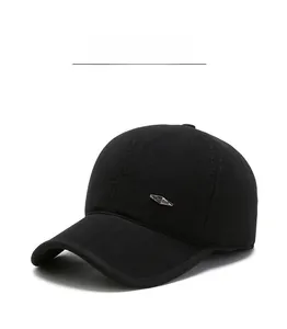 Close-up of black wool texture and silver diamond emblem on warm winter baseball cap