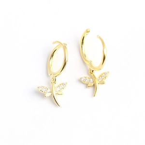 Exquisite gold dragonfly hoop earrings with sparkling diamond-set wings on white background