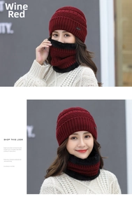 Close-up of burgundy knit hat and neck warmer set with thick black faux fur lining