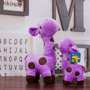 Two purple plush giraffe toys with brown spots against a wooden wall background