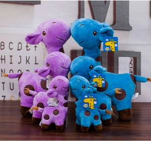 Detailed close-up of colorful plush giraffe toys in purple and blue with soft spotted fabric
