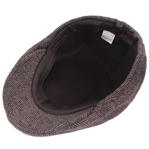 Brown herringbone newsboy cap made of cotton blend fabric, interior view and label