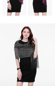 Detail of high-quality evening shawl featuring metallic glitter fabric and elegant tassels
