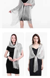Detail view of silver shimmering evening shawl with elegant fringe trim for women