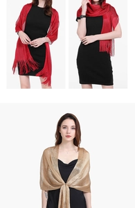 Detail view of elegant red and gold evening shawls with tassels shown in various styles