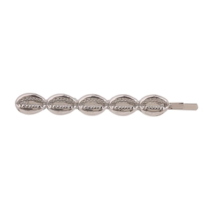 Detailed close-up of a silver metal hair clip featuring five connected seashell designs