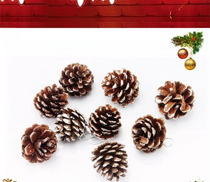 Detail of natural pine cones with snow-effect edges and silver hanging strings