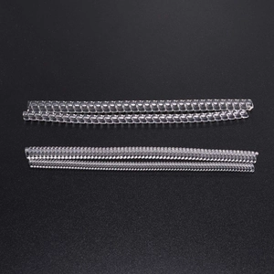 Transparent spiral ring size adjusters for loose rings, 4-piece set on gray background