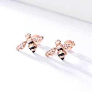 Close-up of S925 silver honey bee stud earrings with rose gold plating and crystals
