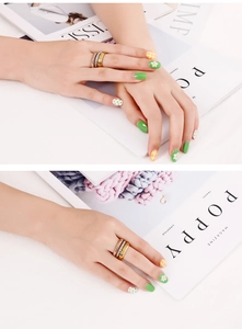 Three-tone stackable stainless steel rings in gold, silver, and rose gold finishes
