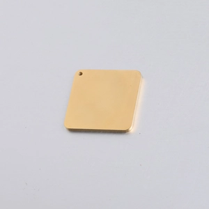 Close-up of a polished gold stainless steel square tag pendant with a single hanging hole