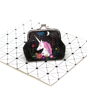 Detail of cartoon unicorn coin purse featuring black floral print and silver kiss lock closure