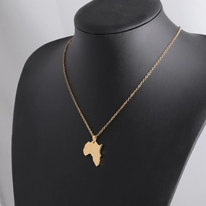 Polished gold stainless steel Africa map pendant necklace on a black mannequin display