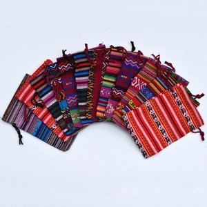 Detailed arrangement of colorful ethnic style cotton drawstring gift bags in various patterns