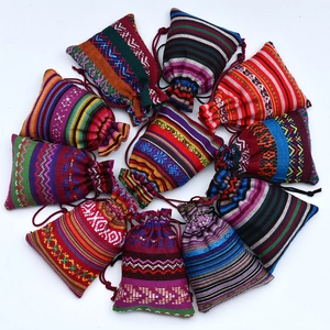 Flat lay of colorful ethnic cotton drawstring bags arranged in a circular pattern