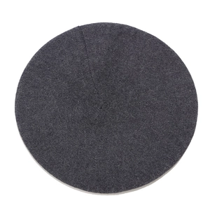 Detailed top view of a dark grey knitted wool beret showing fine textured knit fabric