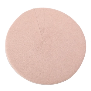 Detailed top view of the light pink knitted wool beret showing fine woven texture and shape